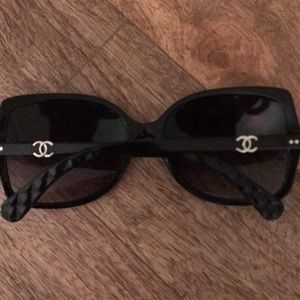 Black oversized Chanel sunglasses.